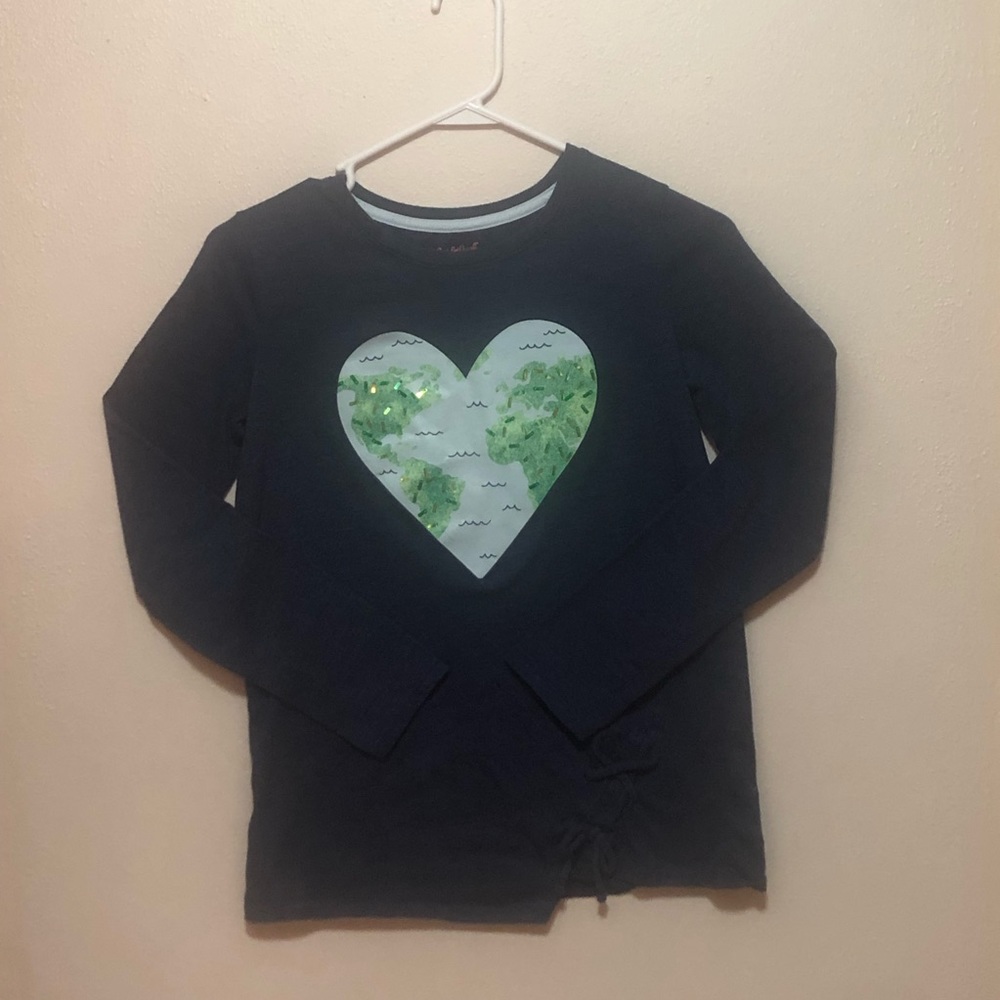 A dark blue long sleeve shirt, extra large in kids, and a cute twist at bottom.